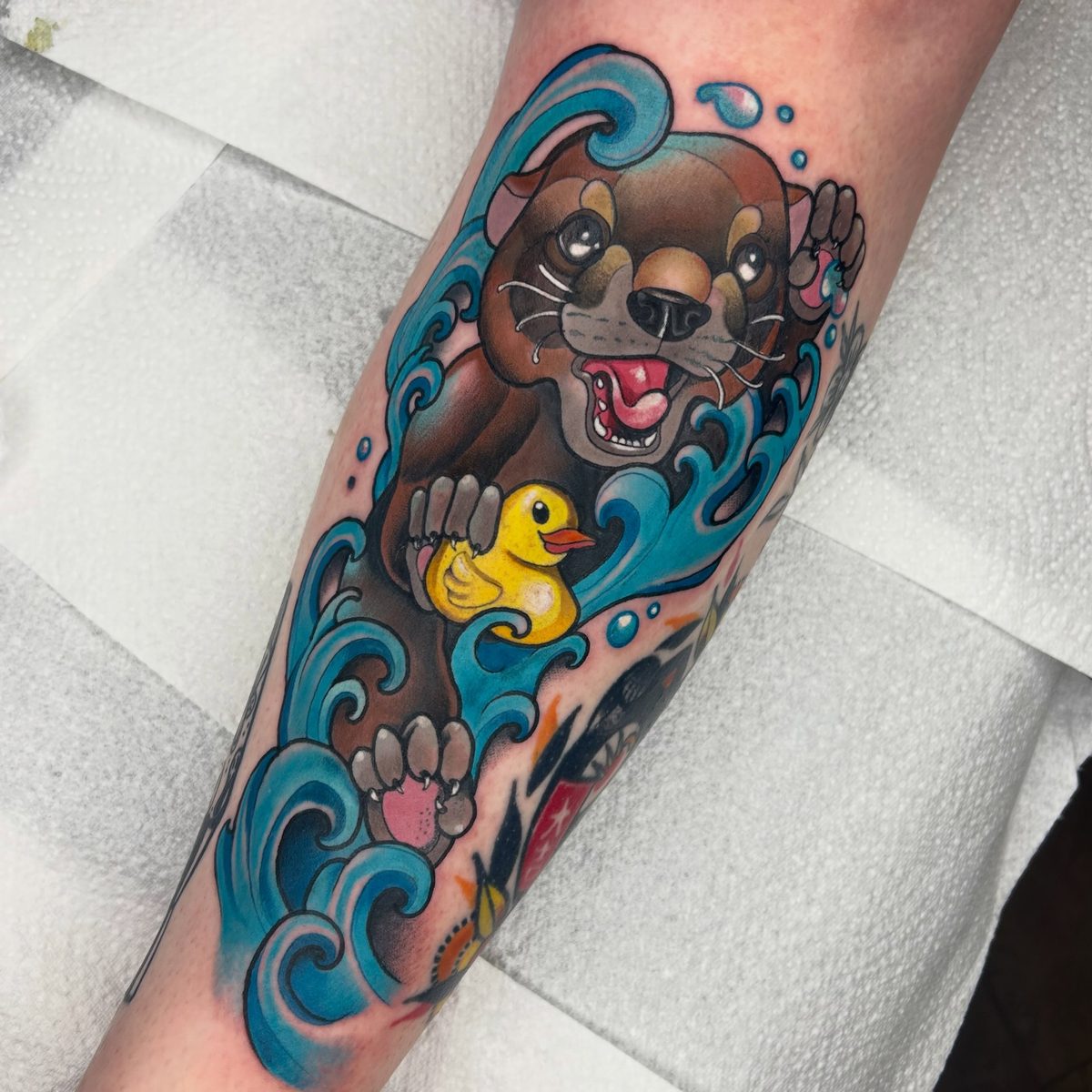 Iron Sky otter and rubber duck tattoo